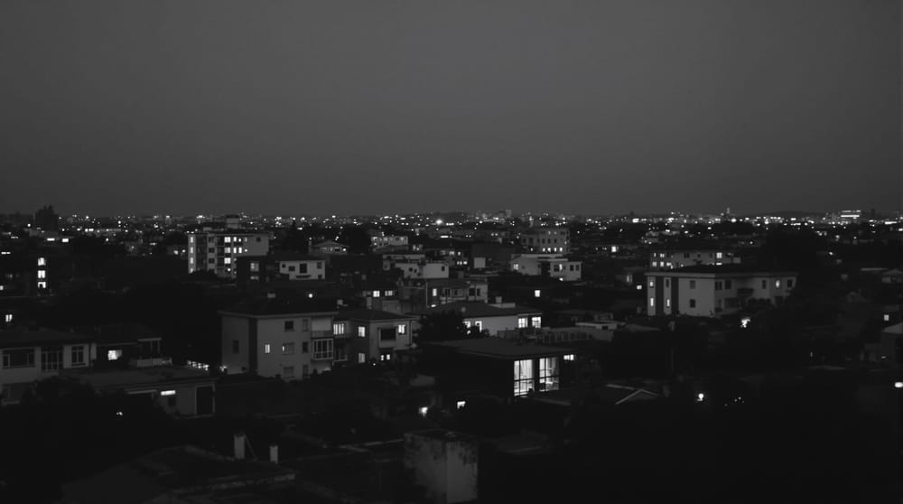 An anonymous urban view at blue hour photographed from an elevated position, with no recognizable skyline.